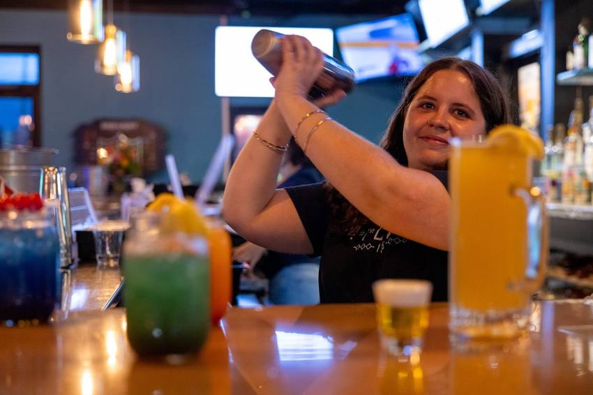Bartender shaking a cocktail at the Midway bar