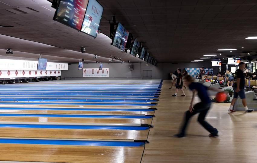A league bowler mid-throw