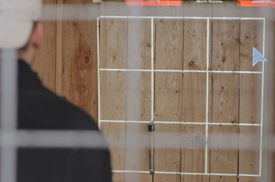 A thrower lining up a shot at the target