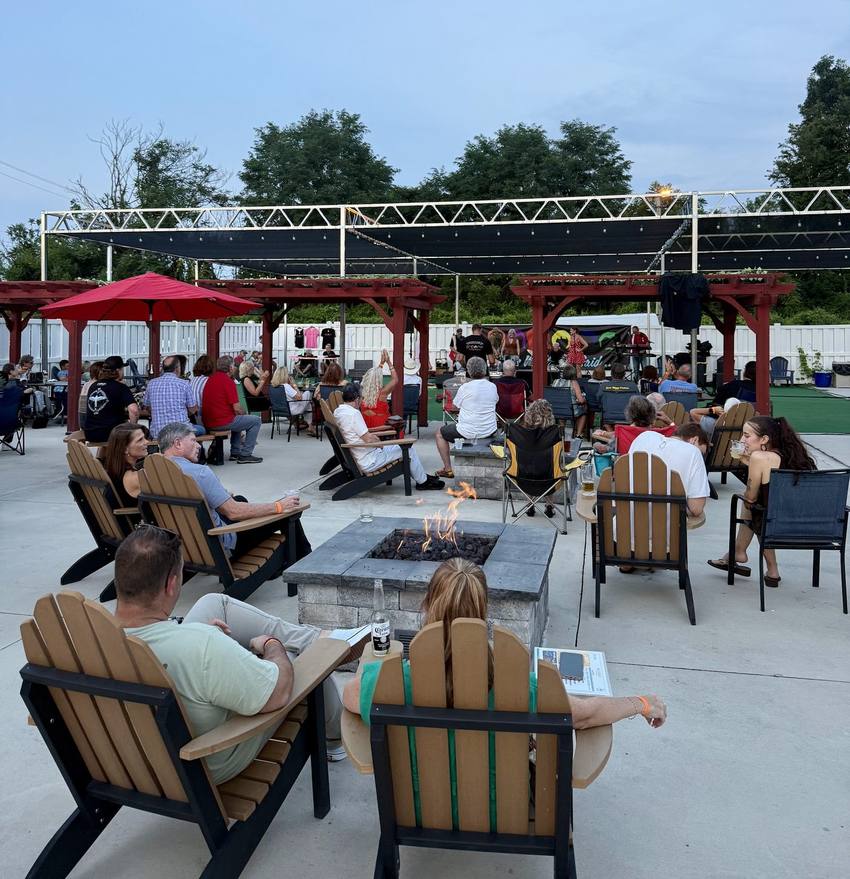 Guests gathered around the fire pits on the Midway patio