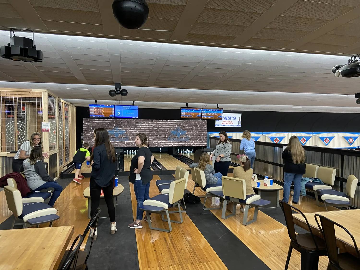 Families playing on the duckpin lanes