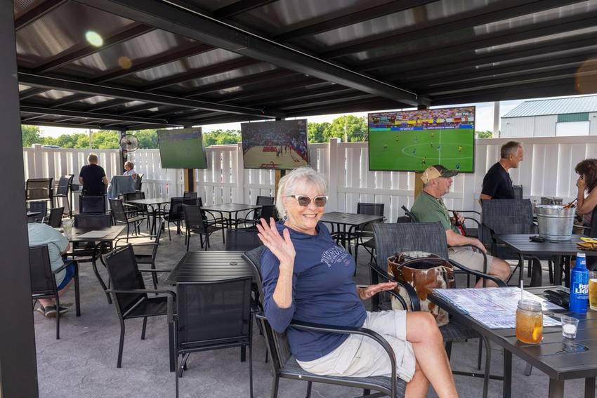 Guests relaxing on the covered Midway patio